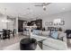 Bright and airy living space featuring an open floor plan, seamlessly connecting the kitchen, and dining area at 25311 N 19Th Ln, Phoenix, AZ 85085