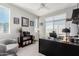 Office with dual windows, built in bookcase, and dark executive desk at 25311 N 19Th Ln, Phoenix, AZ 85085