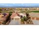 Aerial view of single-story home with desert landscaping at 27062 W Behrend Dr, Buckeye, AZ 85396