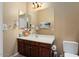 Guest bathroom with single sink and toilet at 27062 W Behrend Dr, Buckeye, AZ 85396