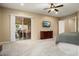 Bright bedroom with sliding doors leading to a private patio at 27062 W Behrend Dr, Buckeye, AZ 85396