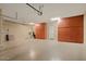 Spacious garage with built-in cabinets and ample storage space at 27062 W Behrend Dr, Buckeye, AZ 85396