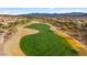 Aerial view of a golf course with surrounding desert landscape and homes at 27062 W Behrend Dr, Buckeye, AZ 85396