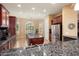 Well-equipped kitchen with an island, granite countertops, and breakfast nook at 27062 W Behrend Dr, Buckeye, AZ 85396