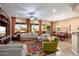 Spacious living room with built-in entertainment center and colorful rug at 27062 W Behrend Dr, Buckeye, AZ 85396