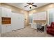 Home office with built-in desk and cabinets at 27062 W Behrend Dr, Buckeye, AZ 85396