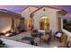 Outdoor patio with seating area, adjacent to the home's exterior at 27062 W Behrend Dr, Buckeye, AZ 85396