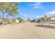Spacious backyard featuring a trampoline and a covered patio area at 3144 N 81St Dr, Phoenix, AZ 85033