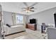 Bright bedroom with a double bed, desk, and window at 3144 N 81St Dr, Phoenix, AZ 85033