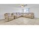 Spacious living room with tile floors and a large sectional sofa at 3144 N 81St Dr, Phoenix, AZ 85033