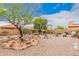 Landscaped backyard with desert plants and gravel at 37110 W Leonessa Ave, Maricopa, AZ 85138