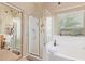 Bathroom with shower, bathtub, and vanity with double sinks at 37110 W Leonessa Ave, Maricopa, AZ 85138