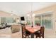 Cozy dining area with a square table and kitchen access at 37110 W Leonessa Ave, Maricopa, AZ 85138