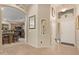 Bright entryway with tile flooring and kitchen view at 37110 W Leonessa Ave, Maricopa, AZ 85138