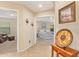 Bright hallway with tile flooring, leading to bedroom and living area at 37110 W Leonessa Ave, Maricopa, AZ 85138