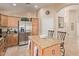 Spacious kitchen with stainless steel appliances and island at 37110 W Leonessa Ave, Maricopa, AZ 85138