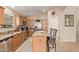 Modern kitchen featuring granite countertops and island at 37110 W Leonessa Ave, Maricopa, AZ 85138