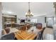 Spacious dining area with a large wooden table and chandelier at 37213 N 17Th Ave, Phoenix, AZ 85086