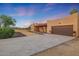 Desert home with attached garage and landscaping at 37213 N 17Th Ave, Phoenix, AZ 85086