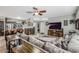 Open living area with sectional sofa, fireplace, and large TV at 37213 N 17Th Ave, Phoenix, AZ 85086