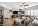 Spacious living room featuring a cozy sectional sofa and a stunning fireplace at 37213 N 17Th Ave, Phoenix, AZ 85086