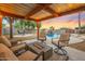 Relaxing backyard oasis with a sparkling pool and fire pit at 37213 N 17Th Ave, Phoenix, AZ 85086