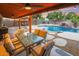 Expansive backyard with a large pool and covered patio dining area at 37213 N 17Th Ave, Phoenix, AZ 85086