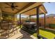 Covered patio with hot tub and artificial turf at 3841 E Patrick St, Gilbert, AZ 85295