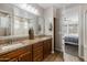 Double vanity bathroom with granite countertops and a large shower at 3841 E Patrick St, Gilbert, AZ 85295