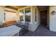 Covered porch with rocking chairs and a wooden bench at 3841 E Patrick St, Gilbert, AZ 85295