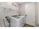 Laundry room with washer, dryer, and shelving at 3841 E Patrick St, Gilbert, AZ 85295