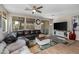 Relaxing living room with a sectional sofa and large screen TV at 3841 E Patrick St, Gilbert, AZ 85295