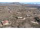 Aerial view showcasing a community of upscale homes with mountain views at 42221 N Deer Trail Rd, Cave Creek, AZ 85331