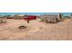 Large backyard with various outbuildings and a fire pit at 43459 N Terrace View Ave, San Tan Valley, AZ 85140