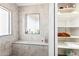 Bathroom features a walk-in shower, built-in shelving, and linen closet at 43459 N Terrace View Ave, San Tan Valley, AZ 85140