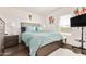 Bright bedroom with a comfortable bed and a TV at 43459 N Terrace View Ave, San Tan Valley, AZ 85140