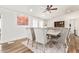Elegant dining room with a large table and seating for eight at 43459 N Terrace View Ave, San Tan Valley, AZ 85140