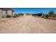 Long gravel driveway leading to a home with a fence at 43459 N Terrace View Ave, San Tan Valley, AZ 85140