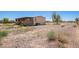 Manufactured home with a large yard and spacious deck at 43459 N Terrace View Ave, San Tan Valley, AZ 85140
