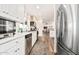 Clean kitchen with white cabinets, stainless steel appliances, and ample counter space at 43459 N Terrace View Ave, San Tan Valley, AZ 85140