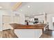 Modern kitchen with white cabinets, wooden countertops, and stainless steel appliances at 43459 N Terrace View Ave, San Tan Valley, AZ 85140