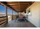 Long covered patio with seating and views at 43459 N Terrace View Ave, San Tan Valley, AZ 85140