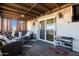 Relaxing covered patio with seating and outdoor TV at 43459 N Terrace View Ave, San Tan Valley, AZ 85140