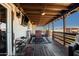 Covered patio with dining area and seating at 43459 N Terrace View Ave, San Tan Valley, AZ 85140