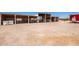 Multiple covered storage sheds with vehicles and equipment at 43459 N Terrace View Ave, San Tan Valley, AZ 85140
