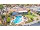 Aerial view of a backyard featuring a pool, putting green, outdoor seating and desert landscaping at 502 E Le Marche Ave, Phoenix, AZ 85022