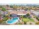 Aerial view of a home with a pool, putting green, tile roof and desert landscaping at 502 E Le Marche Ave, Phoenix, AZ 85022