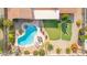 Aerial view of a backyard oasis featuring a pool, spa, putting green, and outdoor dining area at 502 E Le Marche Ave, Phoenix, AZ 85022