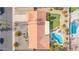 Aerial view of home with a pool, putting green and neutral exterior with tile roof at 502 E Le Marche Ave, Phoenix, AZ 85022