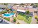 Aerial view showcasing a private backyard with a pool, putting green, and outdoor seating area at 502 E Le Marche Ave, Phoenix, AZ 85022